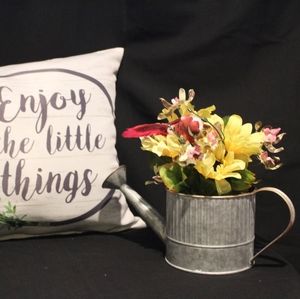 Rustic sprinkler flower arrangement